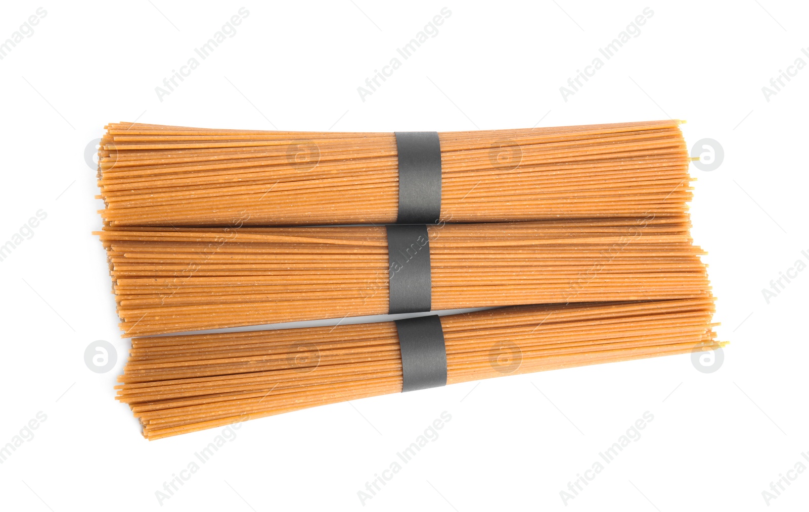 Photo of Uncooked buckwheat noodles isolated on white, top view