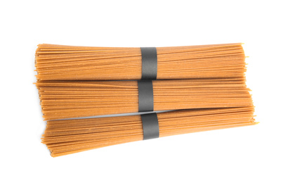 Uncooked buckwheat noodles isolated on white, top view