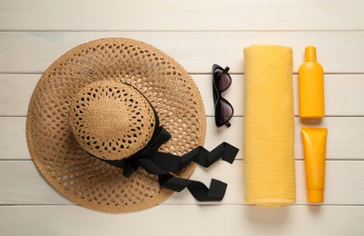 Photo of Different beach objects on white wooden background, flat lay