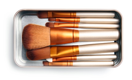 Photo of Box with makeup brushes of professional artist on white background