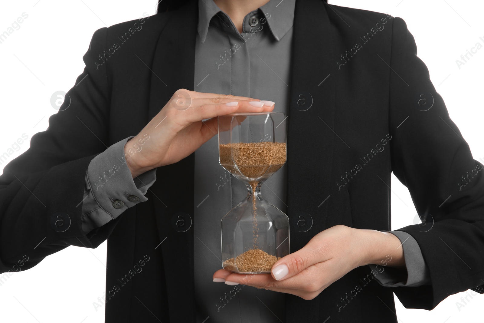 Photo of Businesswoman holding hourglass on white background, closeup. Time management