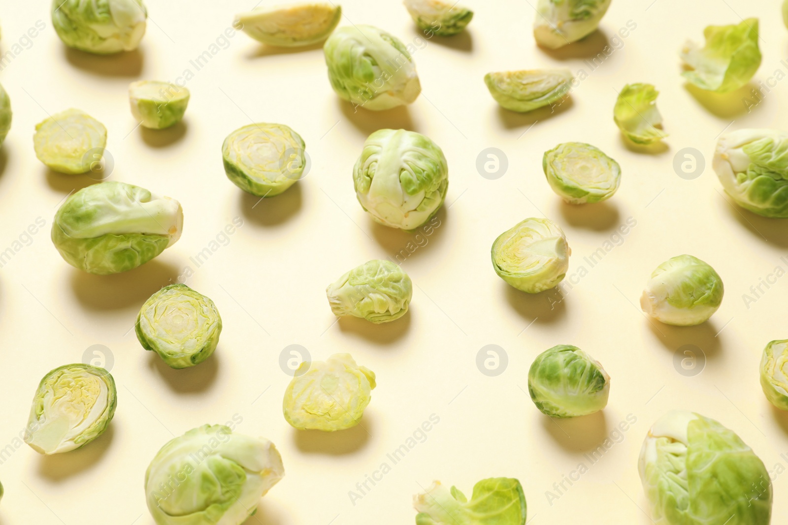 Photo of Fresh Brussels sprouts on color background. Organic vegetables