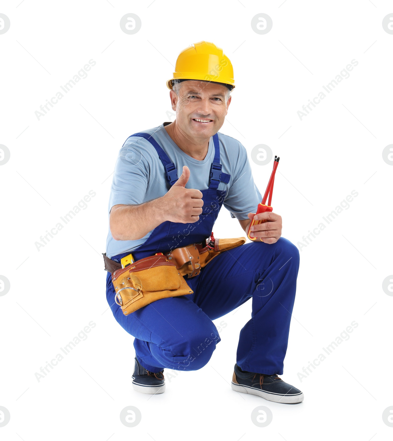 Photo of Electrician with tools wearing uniform on white background