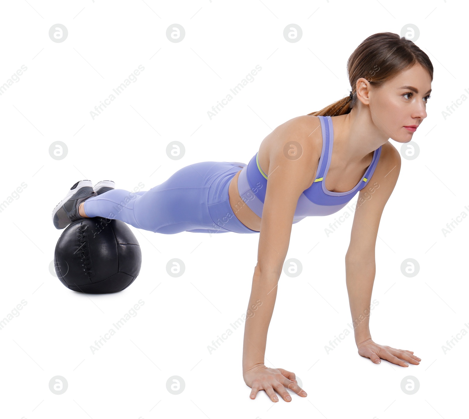 Photo of Athletic woman doing exercise with medicine ball isolated on white