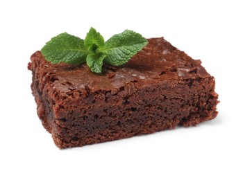 Delicious chocolate brownie with fresh mint leaves on white background