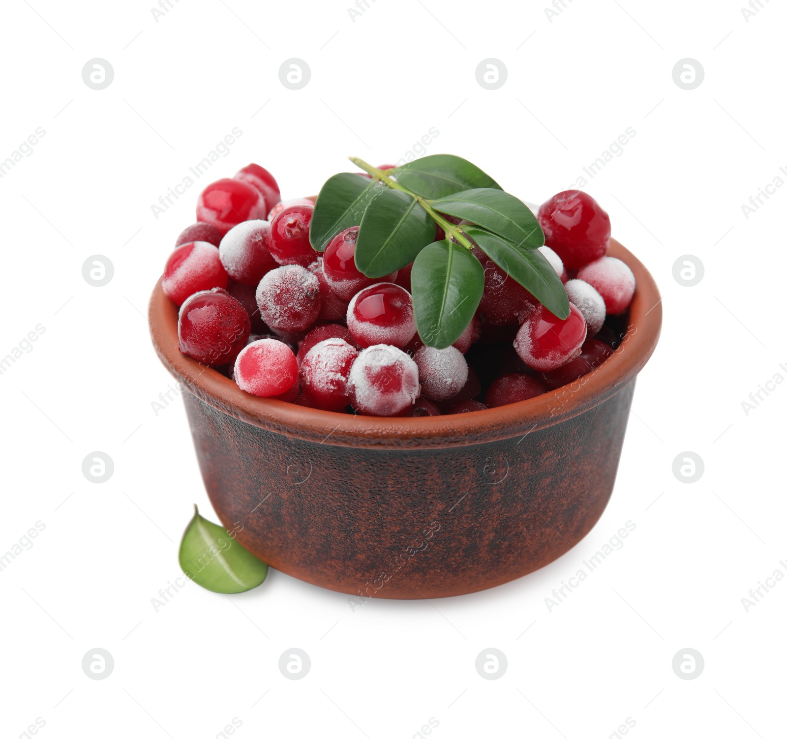 Photo of Frozen red cranberries and green leaves isolated on white