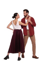 Beautiful couple dancing together on white background