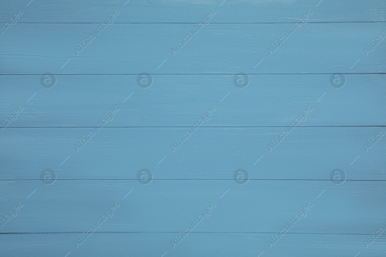 Photo of Texture of light blue wooden surface as background, top view