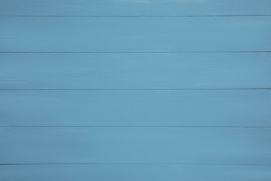 Photo of Texture of light blue wooden surface as background, top view