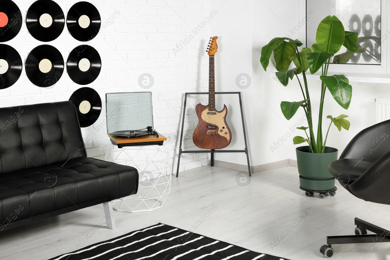 Photo of Living room decorated with vinyl records. Interior design