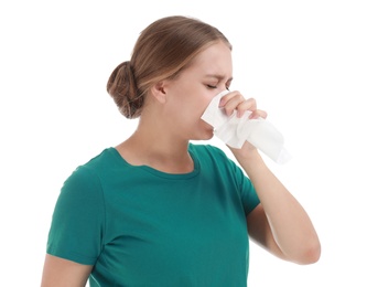 Young woman suffering from allergy on white background