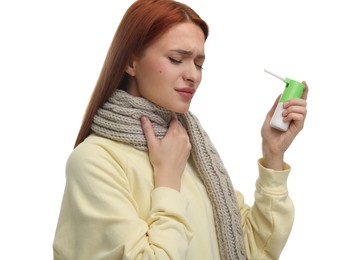 Photo of Young woman with scarf holding throat spray on white background
