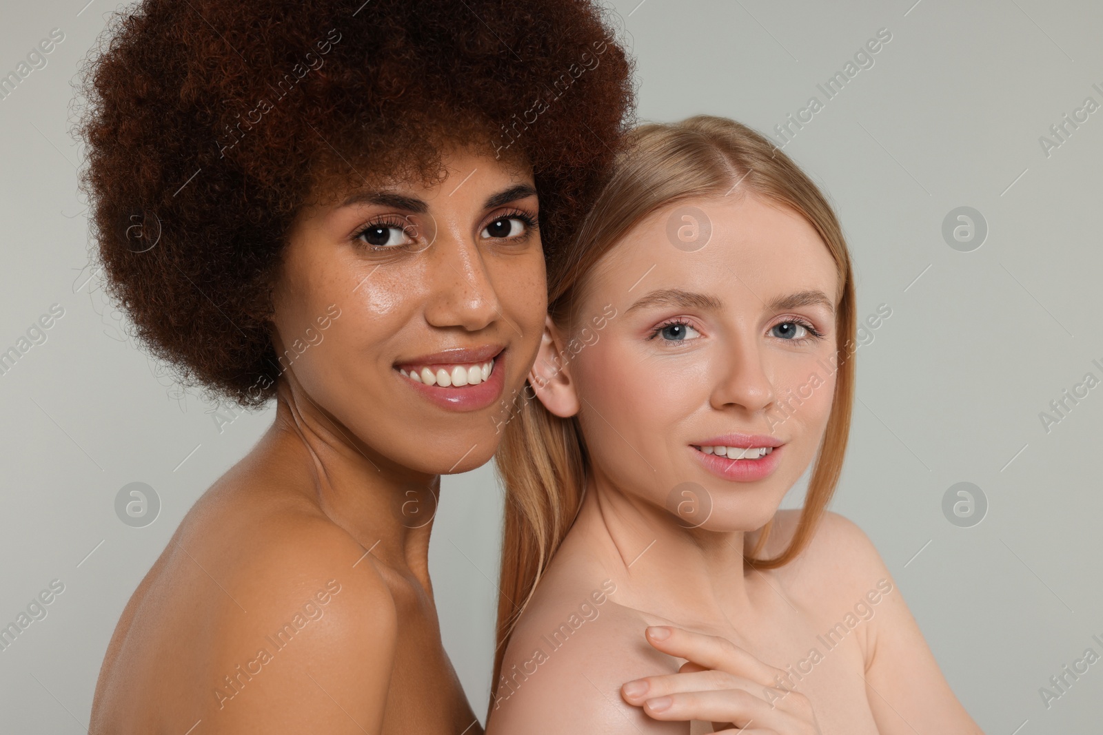 Photo of Portrait of beautiful young women on light grey background