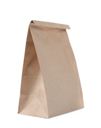 Photo of Closed kraft paper bag isolated on white