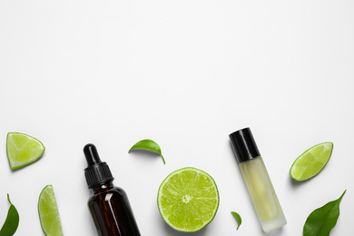 Photo of Composition with lime essential oil on white background, top view