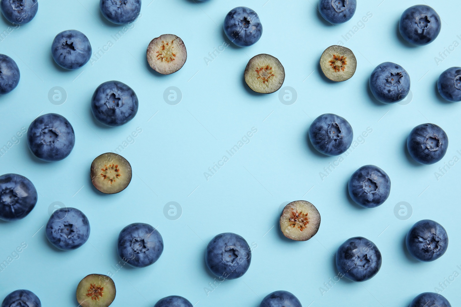 Photo of Flat lay composition with tasty blueberry and space for text on color background