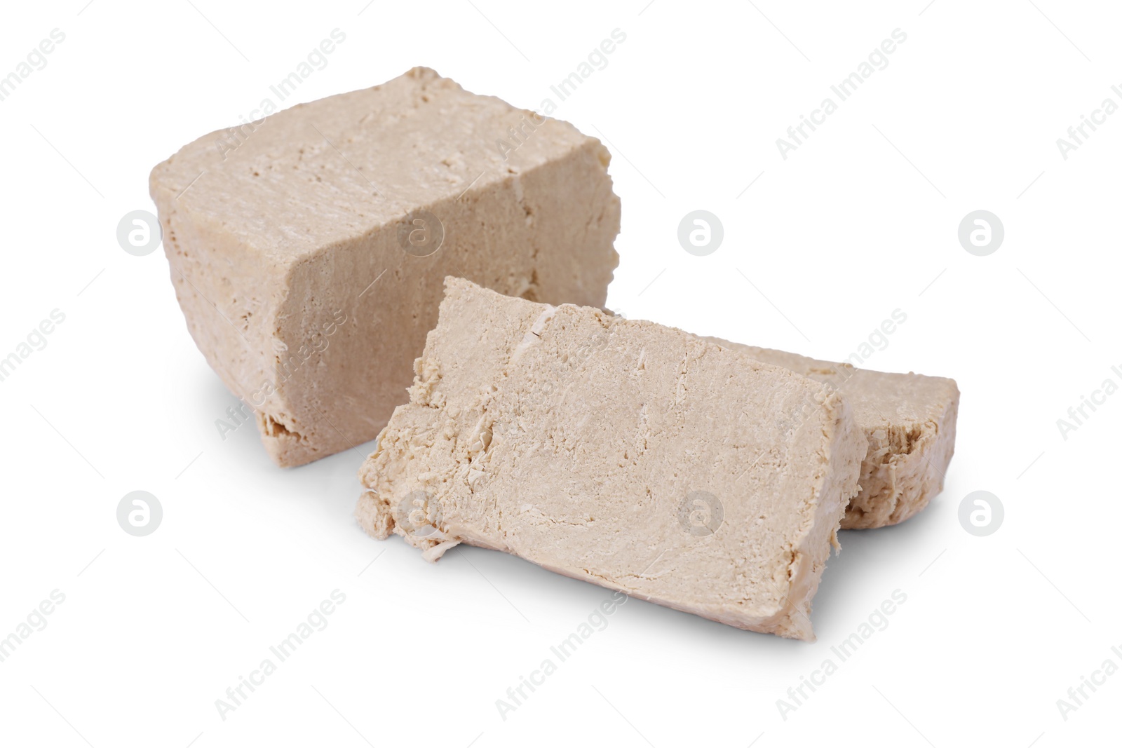 Photo of Pieces of tasty halva isolated on white