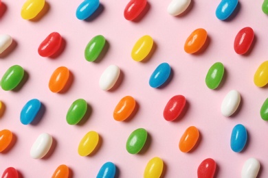 Photo of Bright jelly candies on color background, flat lay