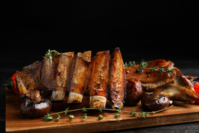 Photo of Delicious roasted ribs served on table, closeup