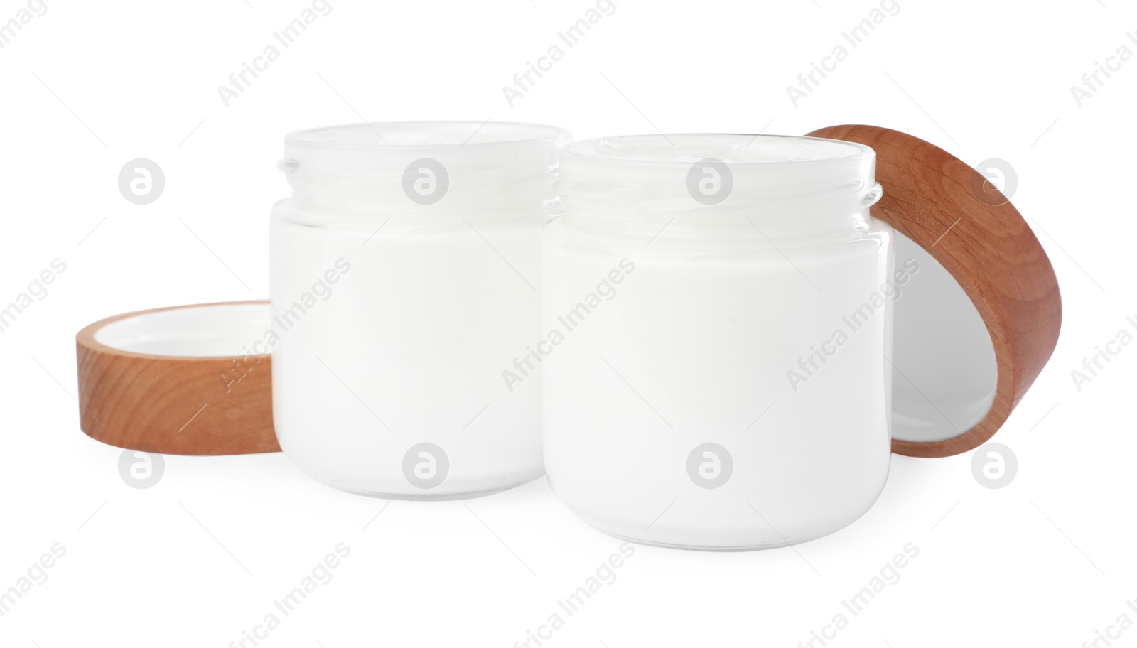 Photo of Jars of face cream isolated on white