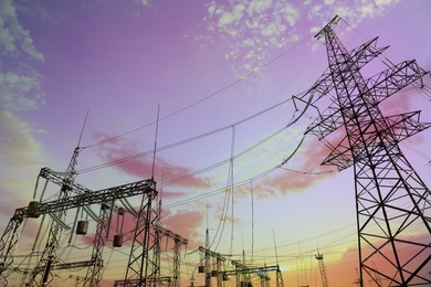 Photo of Modern electrical substation at sunset, low angle view