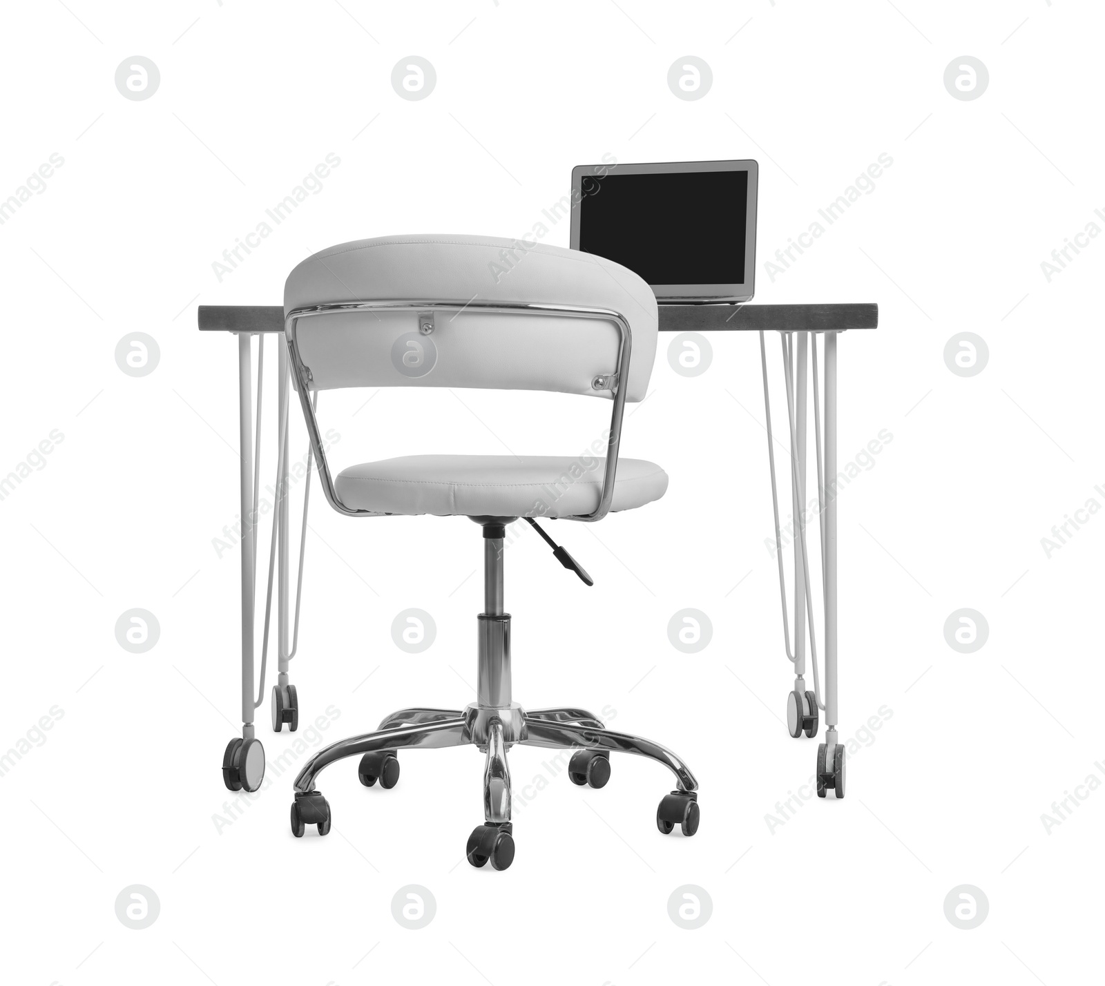 Photo of Stylish workplace with laptop and comfortable chair on white background