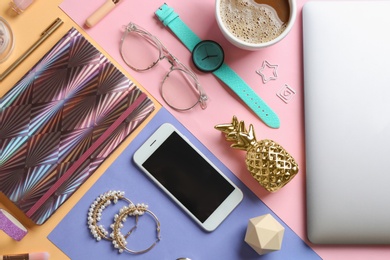 Photo of Flat lay composition with smartphone and accessories on color background. Beauty blogger