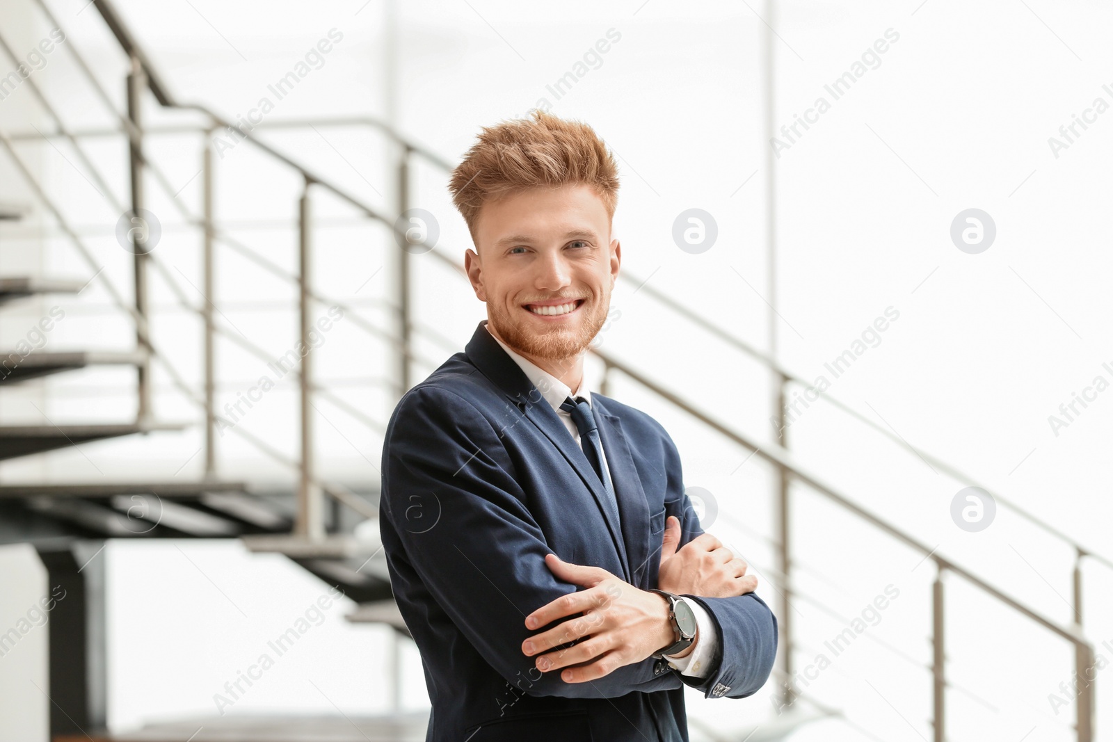 Photo of Portrait of handsome young man in elegant suit indoors