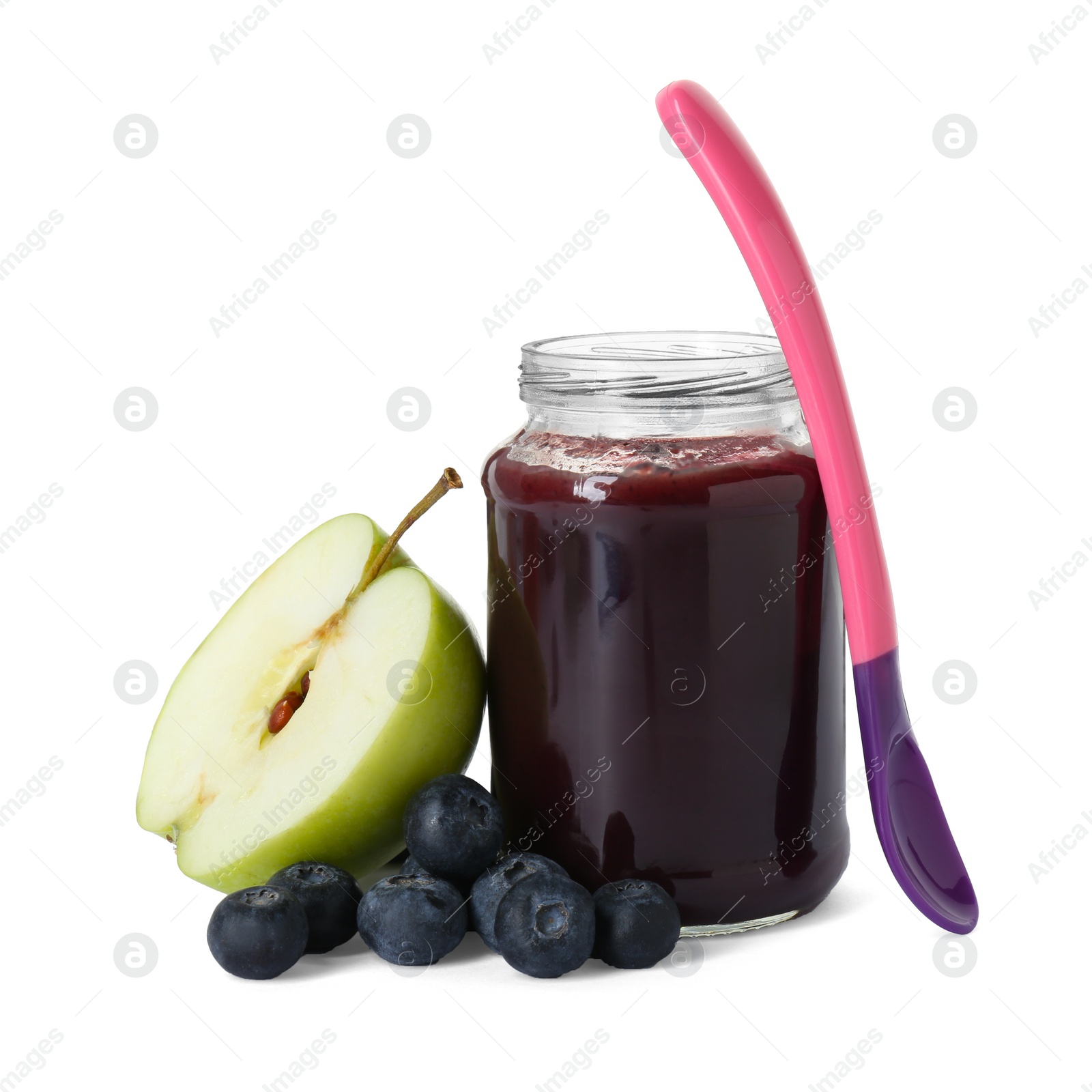 Photo of Jar with healthy baby food, spoon, fresh blueberries and half of apple isolated on white
