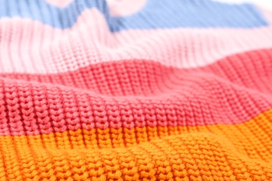 Photo of Texture of cozy warm sweater as background, closeup