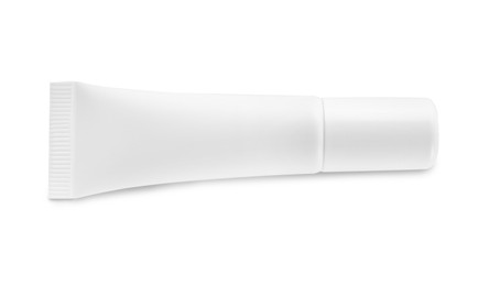 Blank tube of cosmetic product on white background, top view