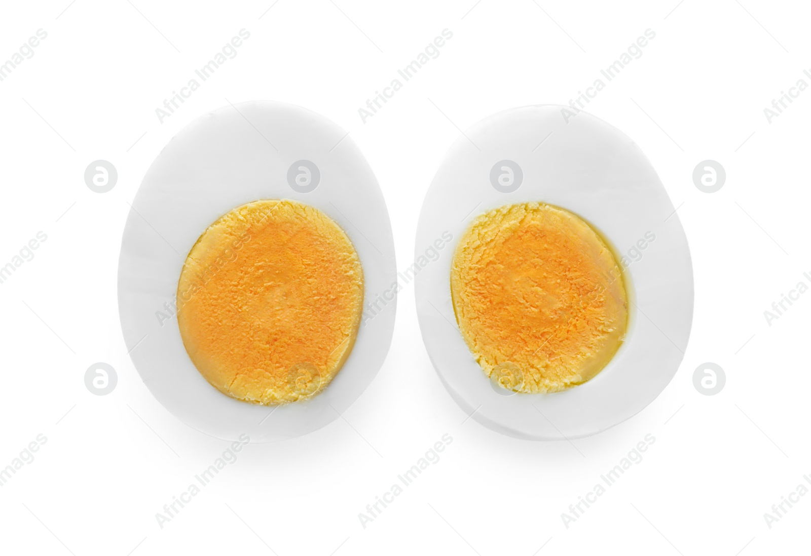 Photo of Halves of fresh hard boiled egg on white background, top view