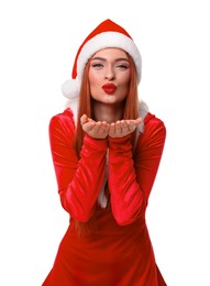 Photo of Young woman in red dress and Santa hat blowing kiss on white background. Christmas celebration