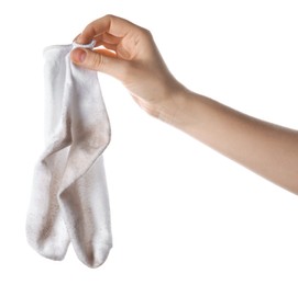 Photo of Woman holding dirty socks on white background, closeup