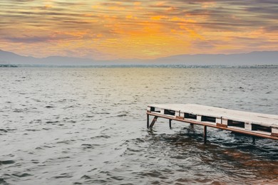 Photo of Beautiful river scene with wooden pier on sunny day