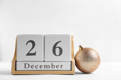 Photo of Wooden block calendar and decor on light background. Christmas countdown