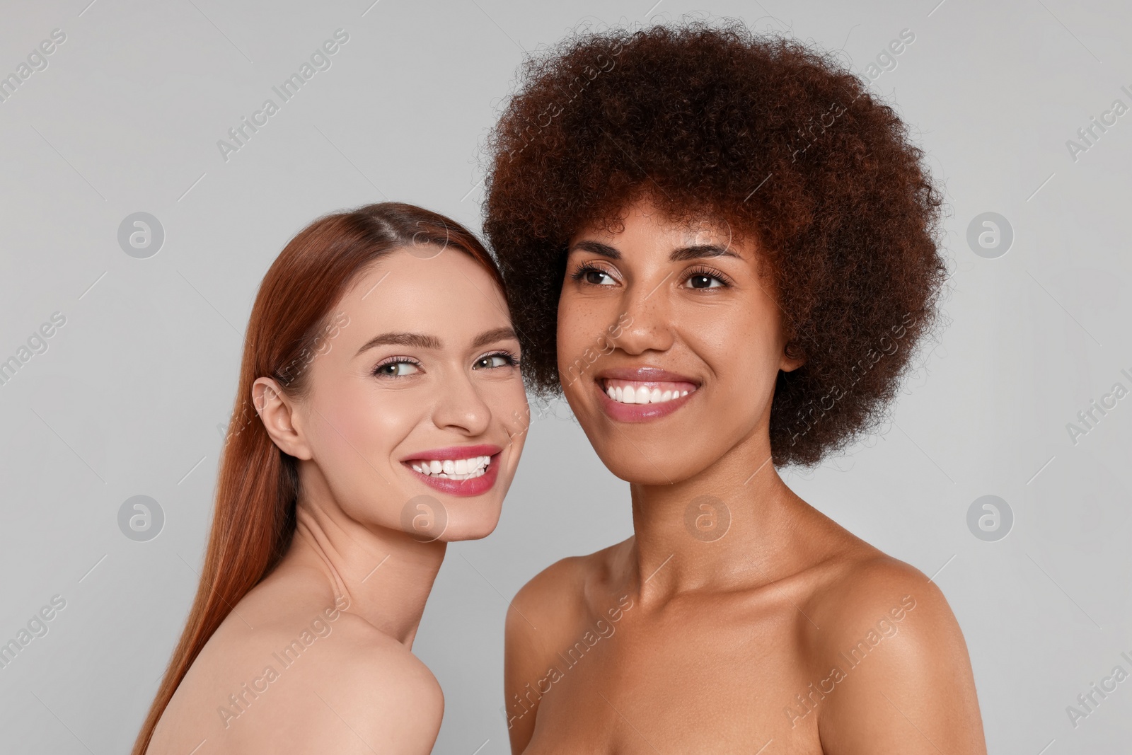 Photo of Portrait of beautiful young women on light grey background