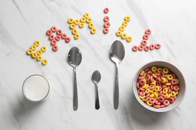 Photo of Word Family, cereal rings, milk and different spoons on white marble table, flat lay