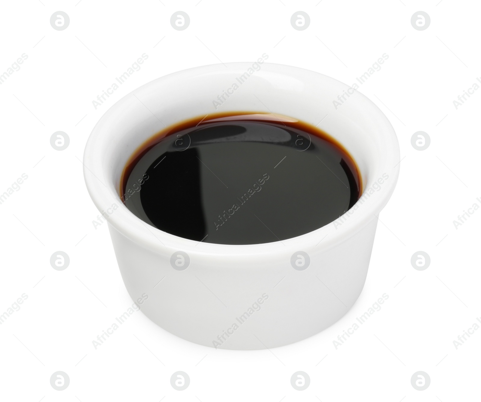 Photo of Tasty soy sauce in bowl isolated on white