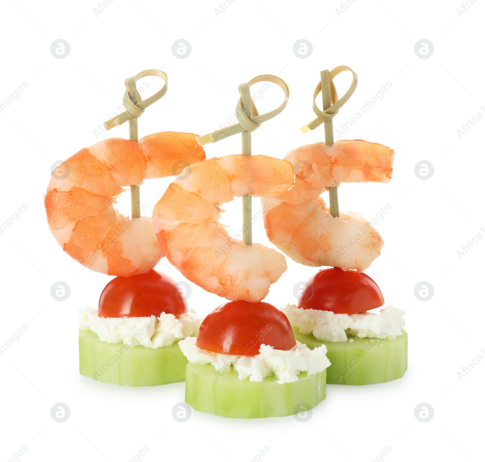 Photo of Tasty canapes with shrimps, vegetables and cream cheese isolated on white