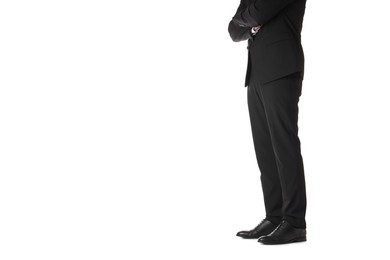 Businessman with crossed arms on white background, closeup