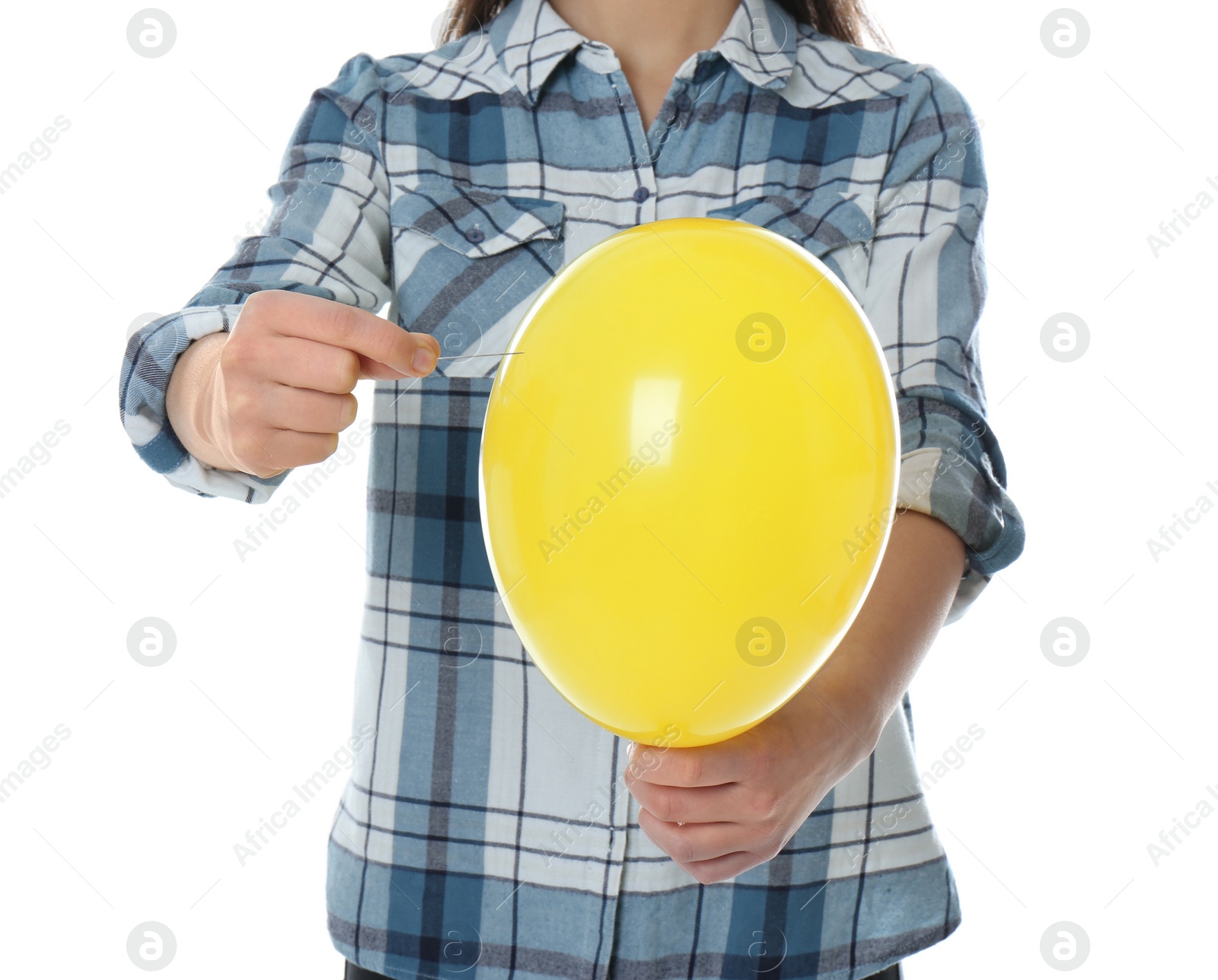 Photo of Woman piercing yellow balloon on white background, closeup