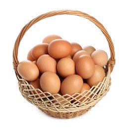 Photo of Chicken eggs in wicker basket isolated on white