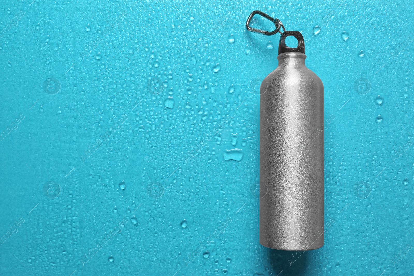 Photo of Sports water bottle on color background. Space for text