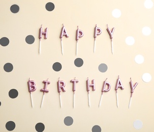Photo of Flat lay composition with birthday candles on color background
