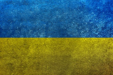 National flag of Ukraine painted on textured surface