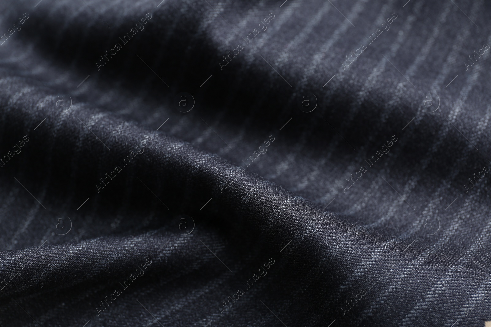 Photo of Texture of dark striped fabric as background, closeup