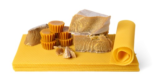 Photo of Different natural beeswax blocks and sheets on white background
