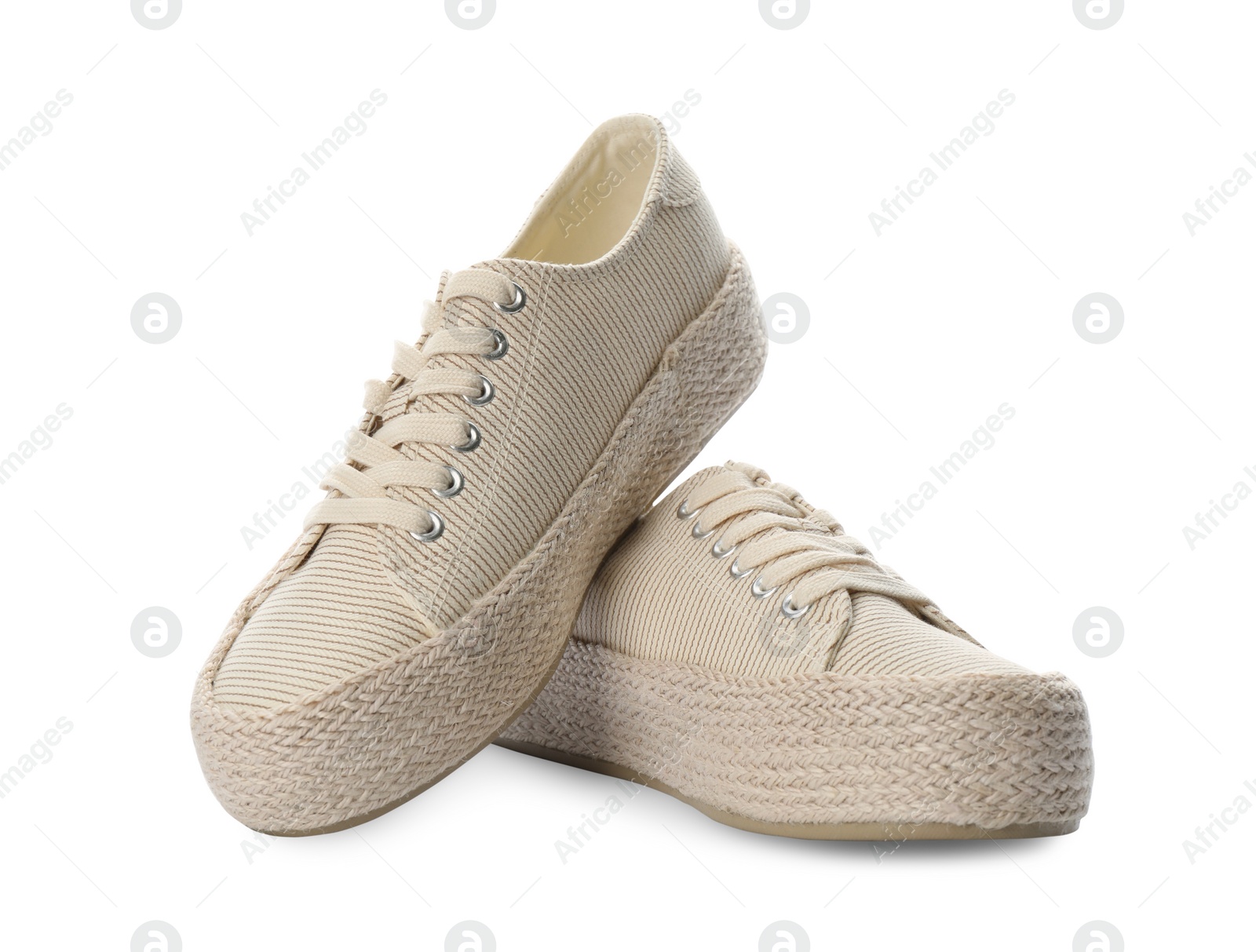 Photo of Pair of stylish sneakers on white background