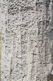 Photo of Closeup view of grey stone surface as background